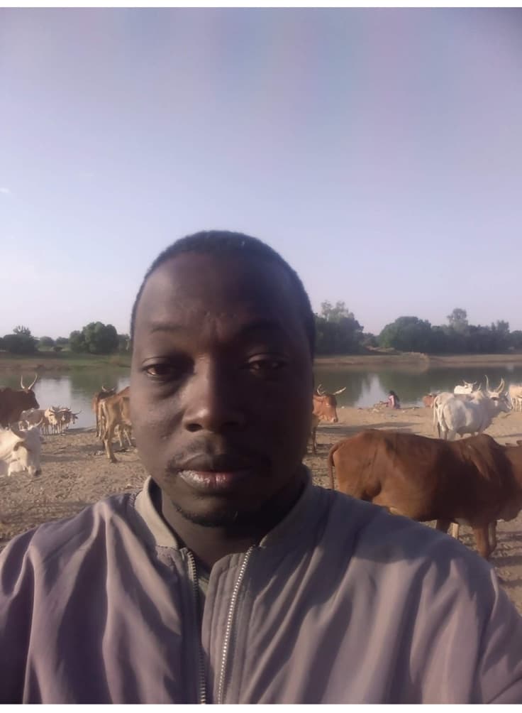 VetSoul Academy founder with cattle during field animal care work